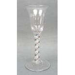 A George III colour twist wine glass, circa 1770, the bell shaped bowl above a double series opaque