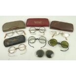 A collection of five pairs of pre-war spectacles, and two half lens pairs. (7)