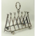 A Victorian silver plated six division toast rack, bearing a registration mark, each divider in the