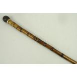 A French bamboo sword stick, turned wooden knob, the blade stamped 'Made in France' and '5', 102cm