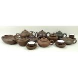 A group of 20th century Chinese Yixing pottery, of modern design, comprising; eight teapots,