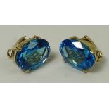 A pair of 14ct gold and topaz clip on earrings, each stone approx 15ct, 11.8g.