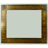 A Glasgow School of Art style copper framed wall mirror, with repousse thistles to each corner and