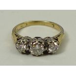 A gold and graduated three stone diamond ring, approximately 0.9ct total, size L, 4.4g.