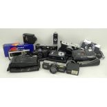 A Konica C35 Automatic, a Halina 110 Pocket Camera SB2/2, an Olympus Trip 35, a Hanimex EF 110