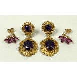 A pair of 9ct gold pendant earrings each set with two amethysts,
