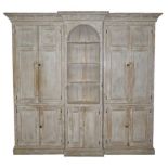 A Georgian pine lime washed breakfront cabinet,
