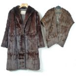 A mink three quarter length fur coat, size 14, a squirrel stole and a white mink 1960's hat.