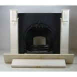 A contemporary white marble fire surround with cast iron insert, 140 by 20 by 124cm high.