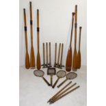 Two pairs of wooden rowing oars, two paddles, a pair of practise cricket wicket stumps,