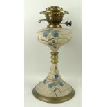 An Edwardian Hinks & Son ceramic and brass mounted oil lamp with duplex burner,