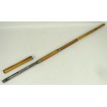 A bamboo centre fired gun stick, deactivated, with twist breech loading mechanism below handle,