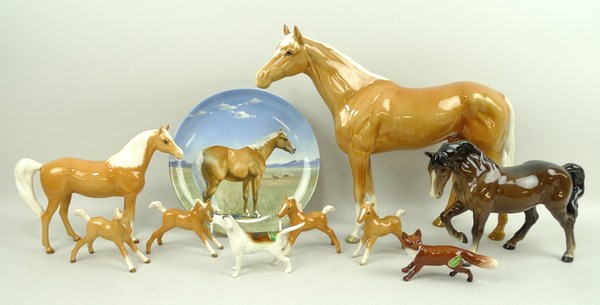 A Beswick Palomino racehorse, 28cm, a Beswick pony, 17cm, four Beswick foals, 8cm,