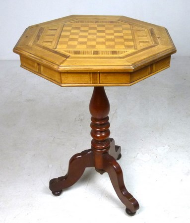 A parquetry games table, with an octagonal top, raised on a turned column and tripod base,