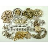 A quantity of costume jewellery, chiefly gold and silver plated necklaces, belts and bracelets.