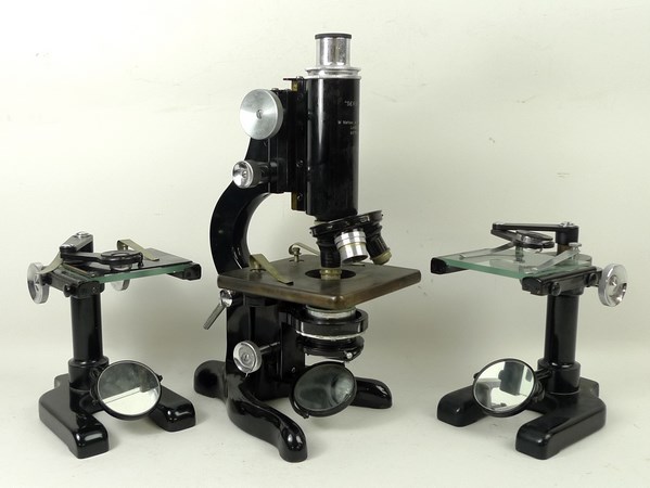 A Watson 'Service' microscope, cased, and two Watson 'Universal' microscopes, cased.