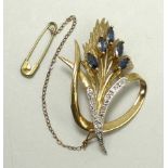 A 9ct gold, sapphire and diamond floral spray brooch, with safety chain as fitted, 9.3g.