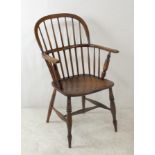 A Windsor ash and elm chair, with low stick back, with H stretcher, 94cm high.