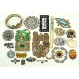 A quantity of costume jewellery including a bangle cast with leaves, paste brooches,