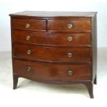 An Victorian bow front chest of drawers with two short over three long graduated drawers,