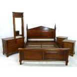 A reproduction mahogany bedroom suite, including a bed, two bedside drawers,
