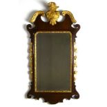 A George I mahogany and giltwood wall mirror, with cresting pediment top,