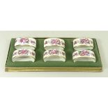 A set of six Royal Crown Derby porcelain napkin rings decorated in the 'Derby Posies' pattern,