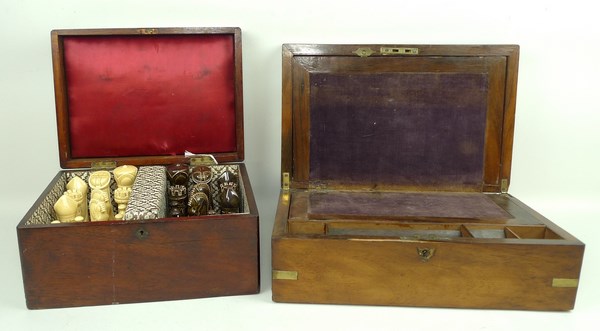 A Victorian rosewood writing slope with fitted interior, brass bound corner and escutcheon,