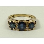 A Victorian style 9ct gold and blue zircon three stone ring, set with pairs of zircons at intervals,