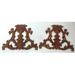 A pair of continental 19th century pine wall carvings, each 30 by 22cm.
