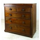 A Victorian rosewood and mahogany chest of drawers, with two short over three long drawers,