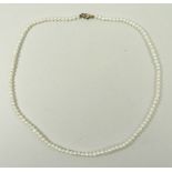 A cultured pearl single strand necklace on a 9ct gold clasp, 40cm long, boxed.