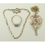 An Edwardian 9ct rose gold and pink tourmaline set pendant, on a 9ct gold chain,