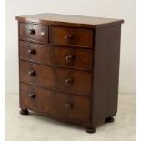 A 19th century mahogany bow front chest of two over three drawers on bun feet,