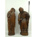 A Continental wooden sculpture modelled as St Nicholas with the three resurrected children in the
