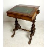 A 19th century rosewood Davenport desk, the writing slope lid with green leather skiver,