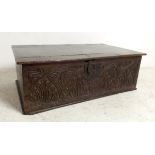 An 18th century oak bible box with a lunette carved foliate frieze, 64 by 39.5 by 22cm high.