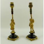 A pair of 20th century brass figural table lamps, modelled as a boy and a girl,