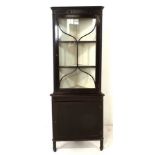 A glazed corner cabinet, 80 by 40 by 180cm high.