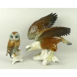 A Karl Ens porcelain figure of a Bald Eagle modelled perched on a bough, 24cm high,