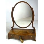 A 19th century mahogany oval toilet mirror,