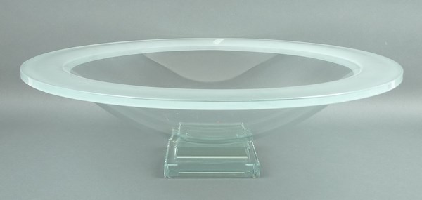 A contemporary glass bowl of shallow circular form with an acid etched rim,