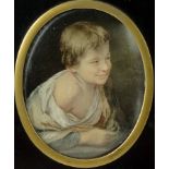 A 19th century miniature portrait of a young boy, unsigned,
