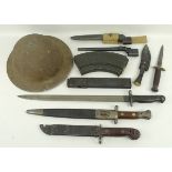 A quantity of militaria, comprising; five bayonets, a kukri, a combat knife,