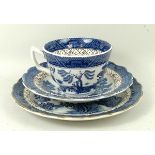 A Booths pottery part dinner and tea service decorated in the 'Real Old Willow' pattern,