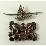 A Victorian gold, ruby and old cut diamond bar brooch formed as an insect,