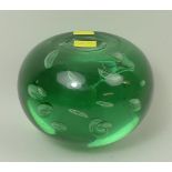 A Victorian green glass dump with air bubble inclusions, 13cm diameter.