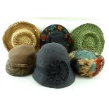 A group of six vintage hats including a 1930's charcoal grey felt cloche,