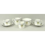 A Shelley porcelain part coffee service printed with fruit, pattern no 11560, comprising cream jug,