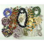A quantity of costume jewellery including jet beaded necklaces,